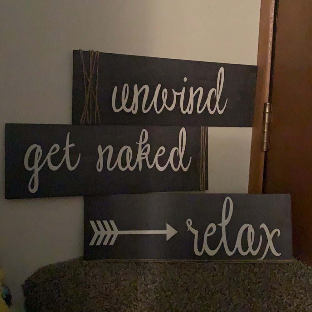 Relax, unwind, get naked wall signs.